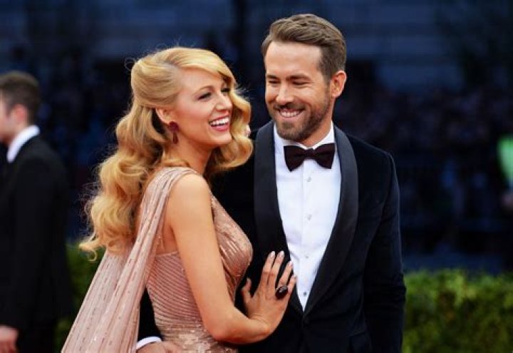 Ryan Reynolds and Blake Lively pose for photos with their newborn at